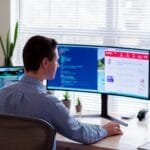 Vagas Remotas na Carbel man in gray dress shirt sitting on chair in front of computer monitor