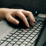 Vagas Remotas na Telavita person using black and gray laptop computer